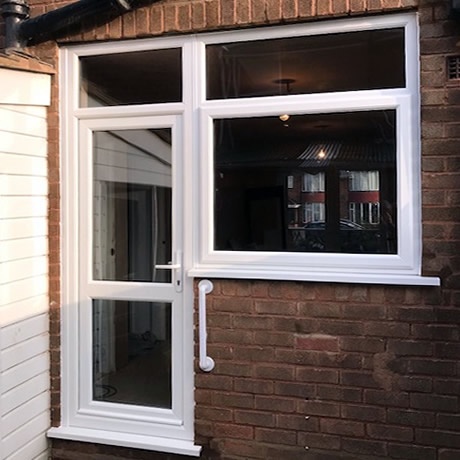 White double glazed PVCu door and window combination installed in solihull by Solihull WDC, www.solihullwindows.co.uk