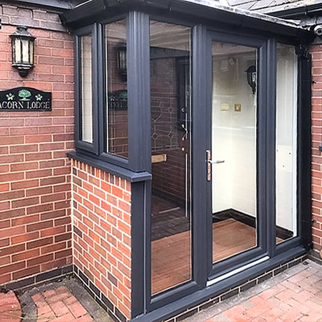 Stylish entrance porch finished in anthracite grey profile installed in Solihull by Solihull WDC